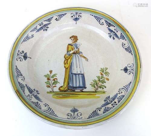 A Continental faience charger of circular form,