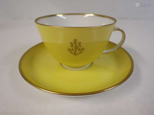 HAMBURG-AMERICAN (H.A.P.A.G.) LINE: A YELLOW PORCELAIN COFFEE CUP AND SAUCER BY FÜRSTENBERG,