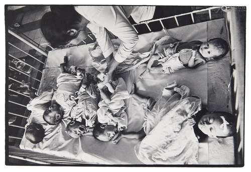 Philip Jones Griffith, British 1936-2008- Orphans from the Vietnamese war in a hospital cot, c.1968;