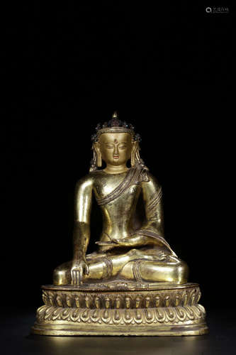 A GILT BRONZE SITTING BUDDHA ORNAMENT