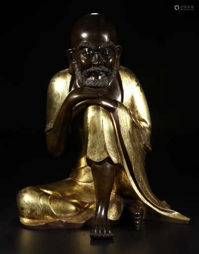 A GILT BRONZE BODHIDHARMA SHAPED BUDDHA