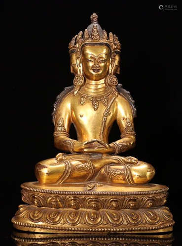 A GILT BRONZE BUDDHA WHICH FOUR FACES