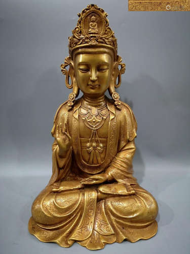 A COPPER GUYIN BUDDHA COVERED IN GOLD GILT