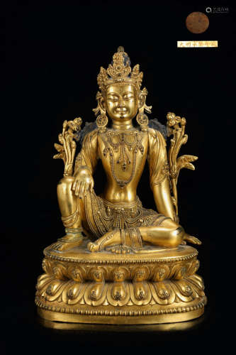 A GILT BRONZE SITTING BUDDHA