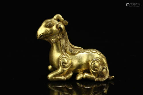 A COPPER GILT FORTUNE BEAST ORNAMENT