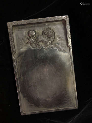 A SOTNE INK SLAB CARVED IN BEAST