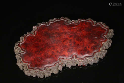 A RED WOOD PLATE