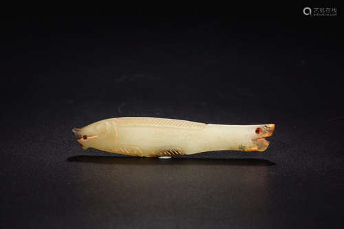 A HETIAN JADE FISH SHAPED ORNAMENT