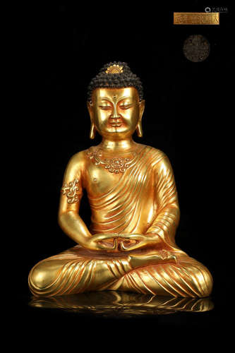 A GILT BRONZE SITTING BUDDHA