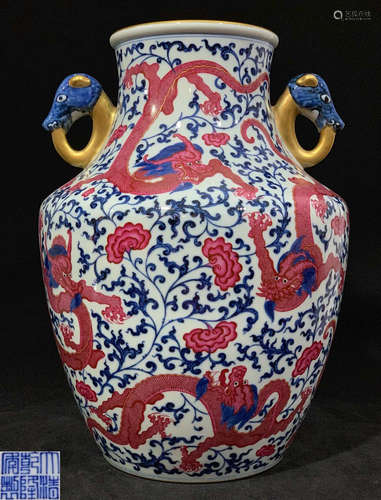 A PORCELAIN VASE CARVED IN DRAGONS & FLOWERS