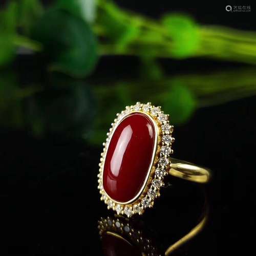 AN EGG SHAPE AKA TYPE RED CORAL RING WITH 18K GOLD BAND