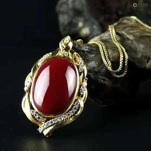 A RED EGG SHAPE AKA TYPE RED CORAL PENDANT WITH 18K GOLD NECKLACE