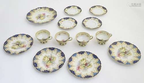 An Edwardian tea set comprising, 4 tea cups and