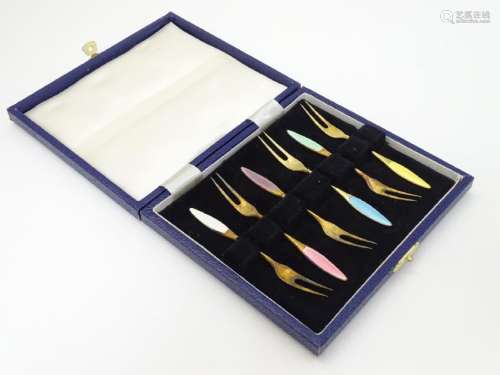 A cased set of 6 Danish silver gilt pickle forks with