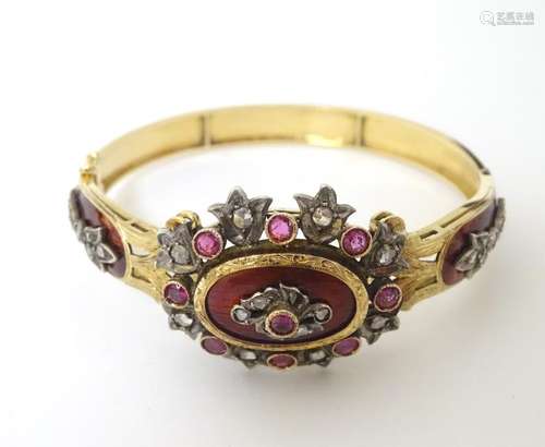 A charming 18ct gold bangle bracelet set with diamonds