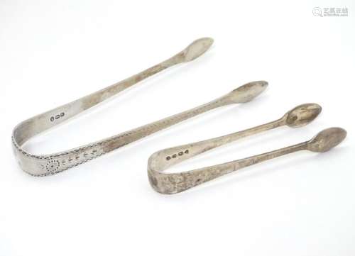 Geo III silver sugar tongs with bright cut decoration,