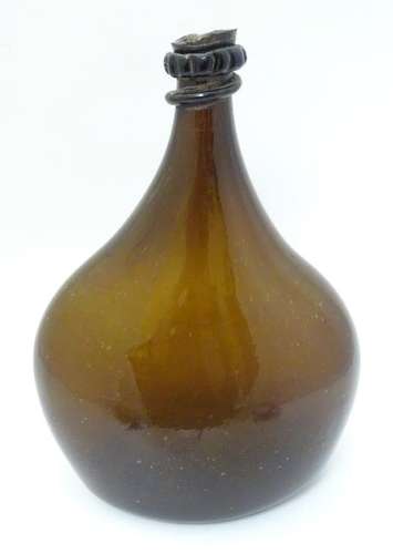 An 18thC Georgian brown glass large bottle with applied