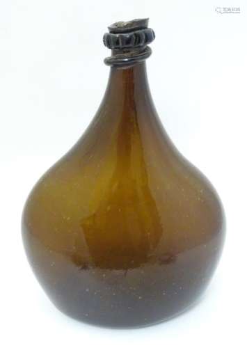 An 18thC Georgian brown glass large bottle with applied