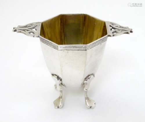 A silver octagonal formed salt / pepper base with twin