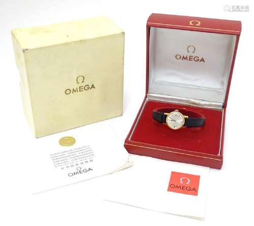 Omega : a gold plate ladies mechanical wrist watch with