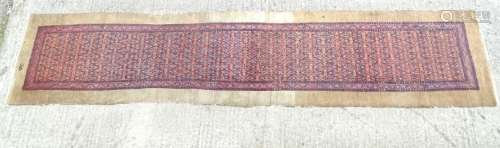 Carpet / Rug : a hand woven Signed Runner with a red