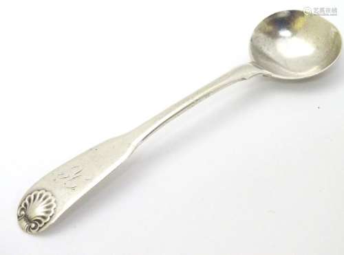A silver fiddle and shell pattern salt spoon hallmarked
