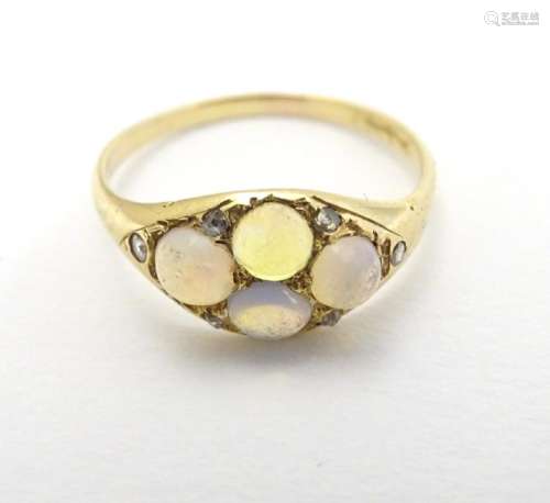 A late 19thC / early 20thC gold ring set with 4 water