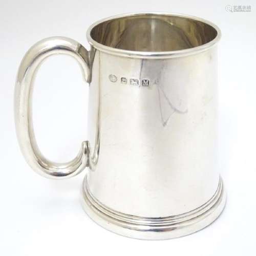 A silver tankard hallmarked Birmingham 1936 maker