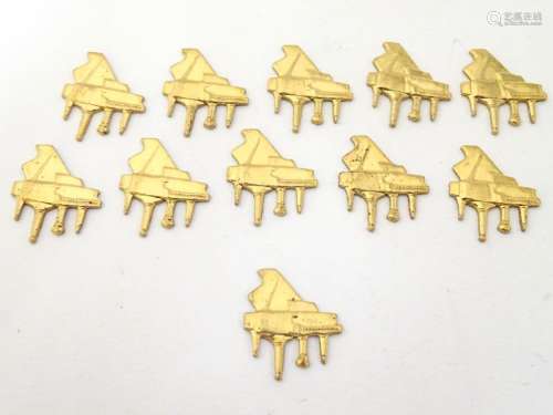 A quantity of gilt metal 6 findings of grand piano