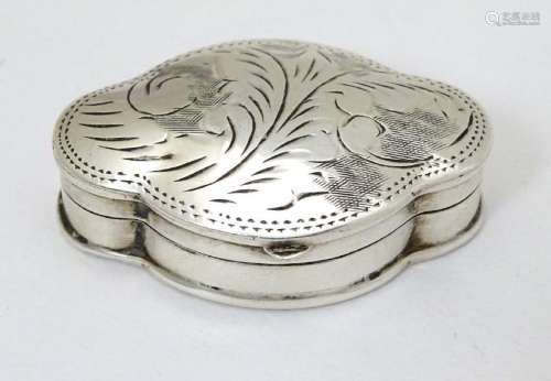 A silver pill box of shaped form with hinged lid and