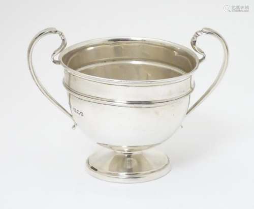 A twin handled trophy cup hallmarked London 1932 maker
