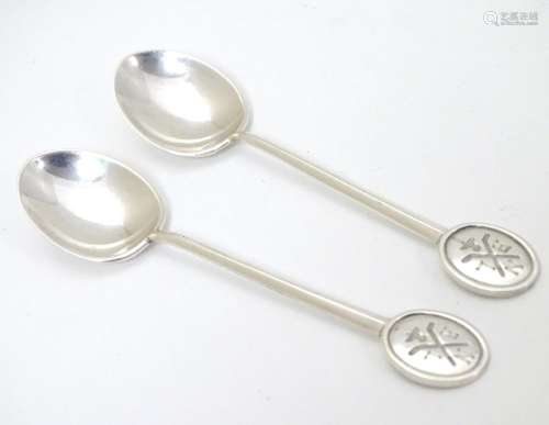 A pair of silver teaspoons marked RNLI to handles and