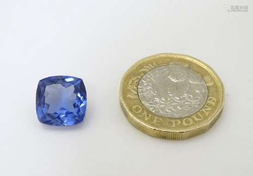 Unmounted stone: A blue cushion cut tanzanite, approx