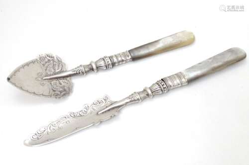 A silver jam / preserve spoon with silver handle