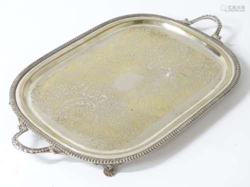 A large oval silver plate tray 23 1/2'' x 17 1/2''