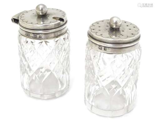 Cut glass pepper pot and mustard pot with silver tops