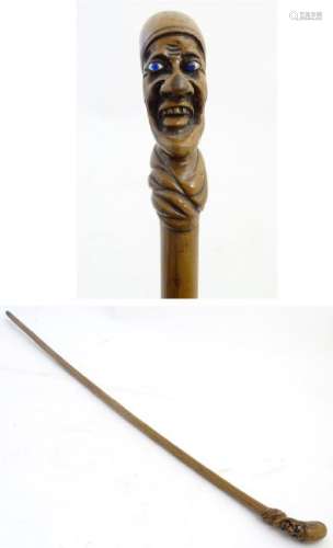 Folk-Art Walking Stick: A grotesque head walking cane,