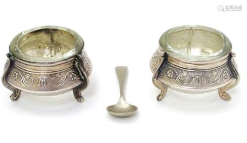 A pair of Continental white metal salts with floral