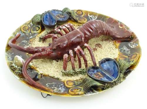 A 20thC Portuguese Palissy style majolica dish with an