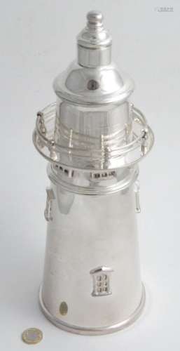A novelty silver plate cocktail shaker formed as a
