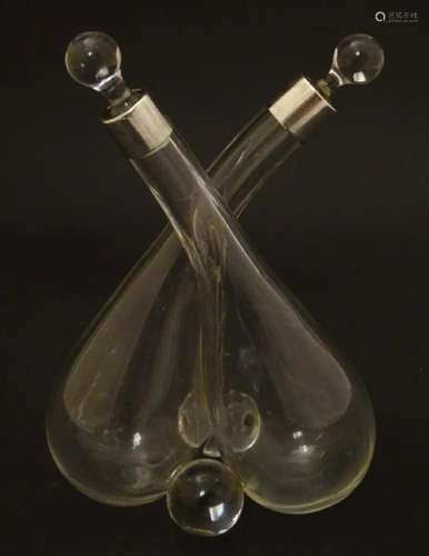 Cross oil and vinegar bottles: a glass pair of oil and