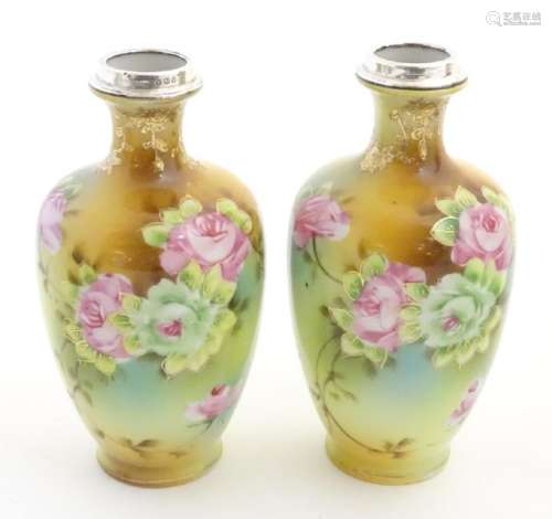 A pair of small Japanese baluster vases with hand