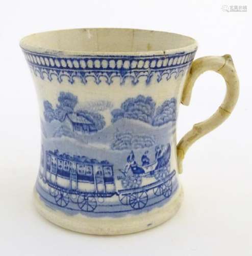 A 19thC blue and white tankard decorated with a train