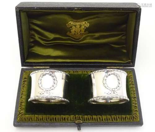 A cased pair of silver napkin rings hallmarked