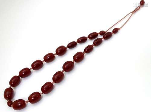 A vintage necklace of graduated cherry amber coloured