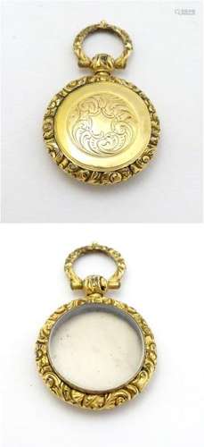 A 19thC pinchbeck locket pendant, approx 7/8'' diameter