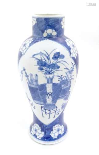 A Chinese, blue and white baluster vase decorated with
