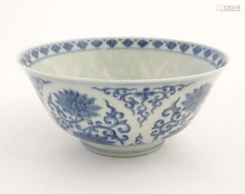 A Chinese blue and white bowl decorated with flowers