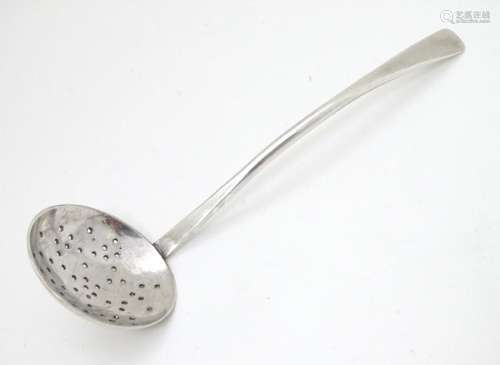 A silver sifter spoon hallmarked London 1991 maker SP.