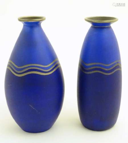 Two blue studio pottery two-tone vases decorated with
